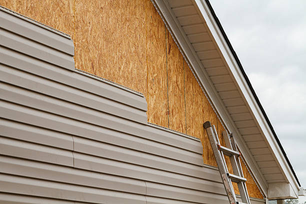 Professional Siding technician working in Germantown, MD